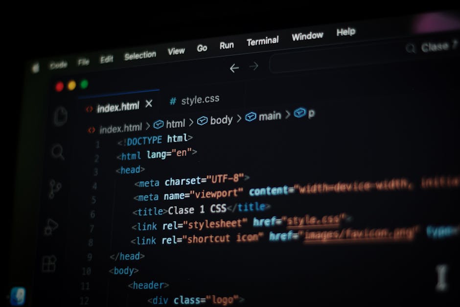 A computer screen displaying a blurred view of code with multicolored lines on a dark background. The code includes HTML and CSS syntax, with visible tags and property declarations in red, green, blue